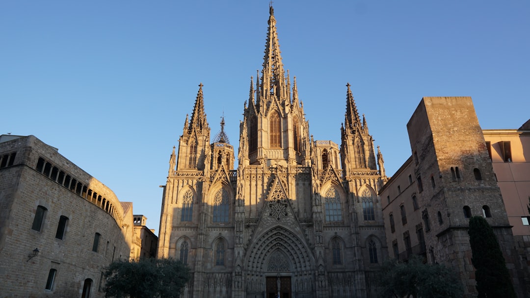 Barcelona cathedral towers above a plaza.